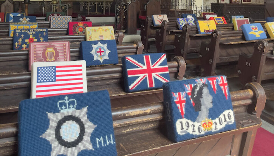 Embroidered kneelers inside a church