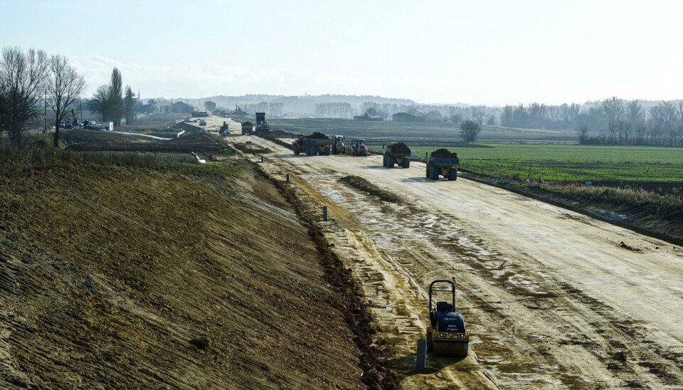 Earthworks and construction vehicles on the A69 motorway site in rural Verfeil, France.